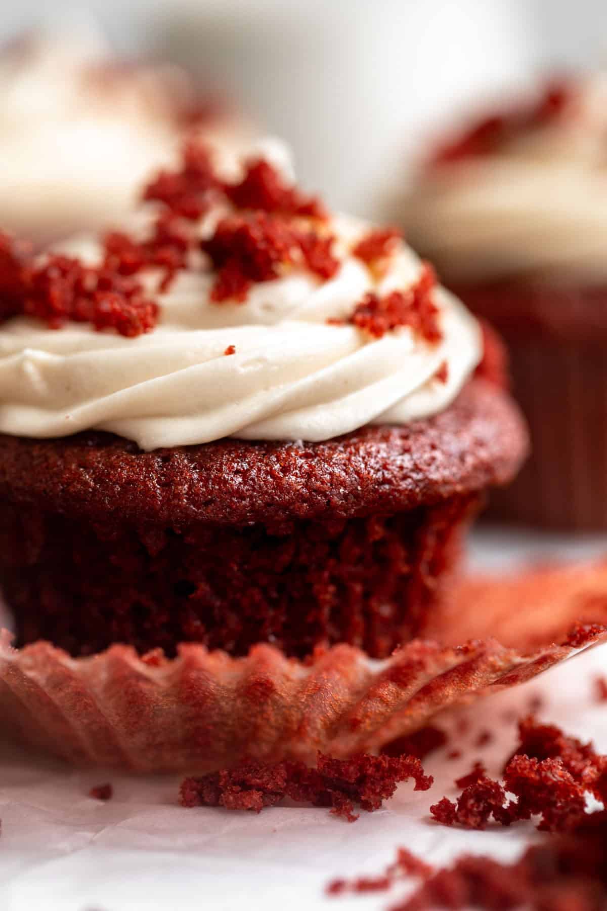 gluten free red velvet cupcakes with cream cheese frosting on top