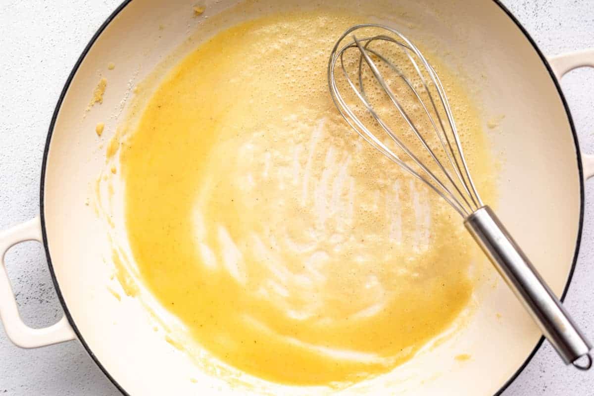 whisking the butter and flour in a pot