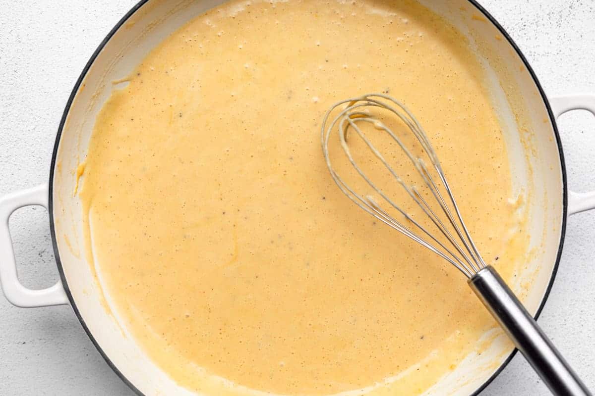 cheese sauce simmering in a pan