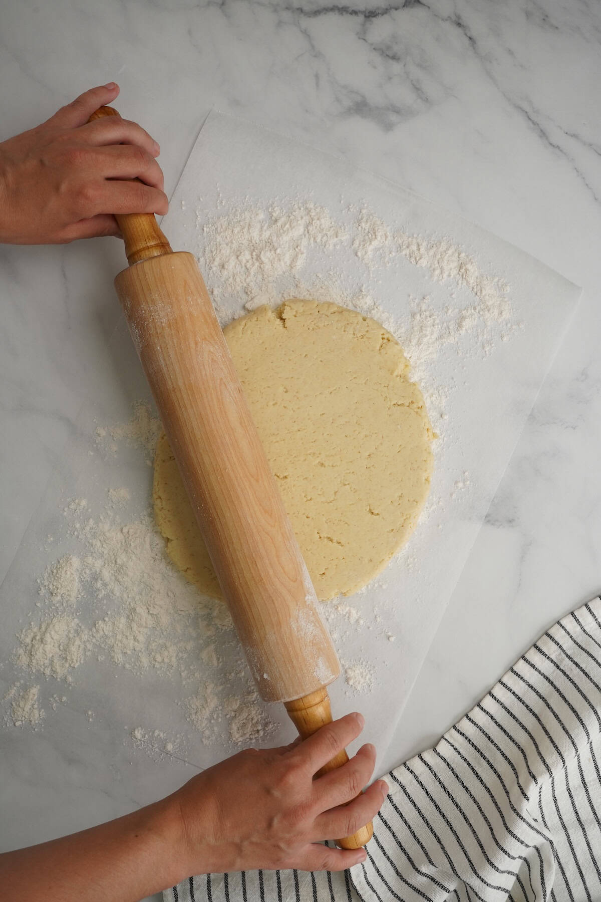 rolling out the dough with a rolling pin