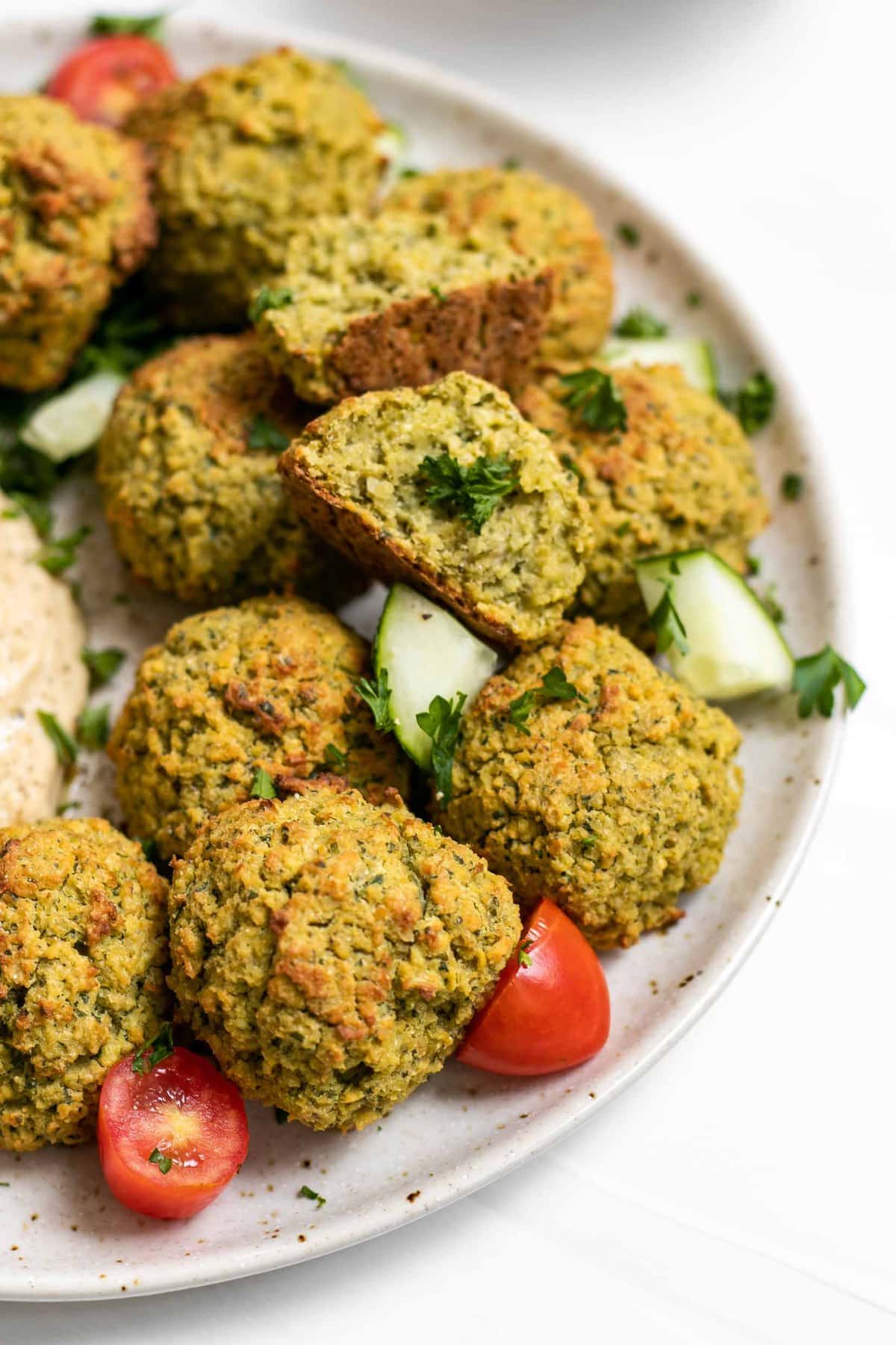 Vegan baked falafel recipe on a plate with parsley.