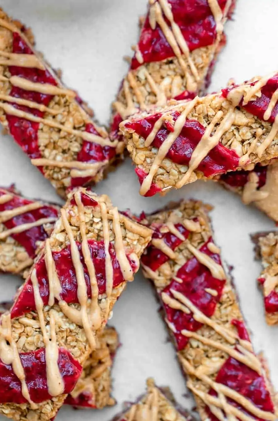 No bake granola bars with peanut butter and jelly on top.