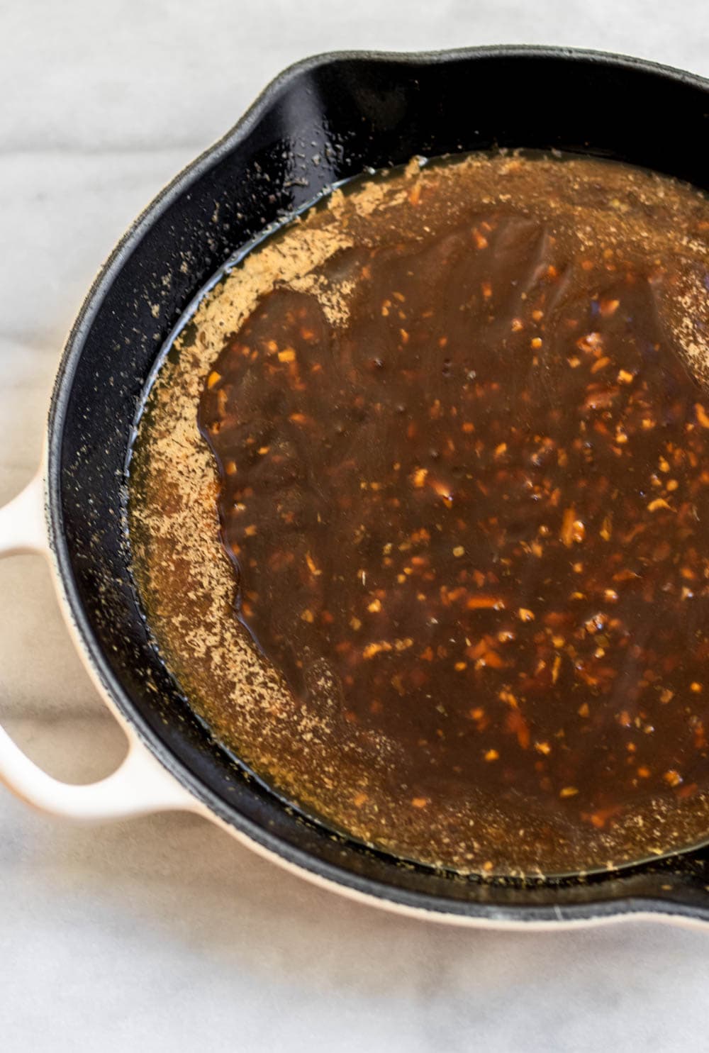 Sesame sauce in a saute pan.