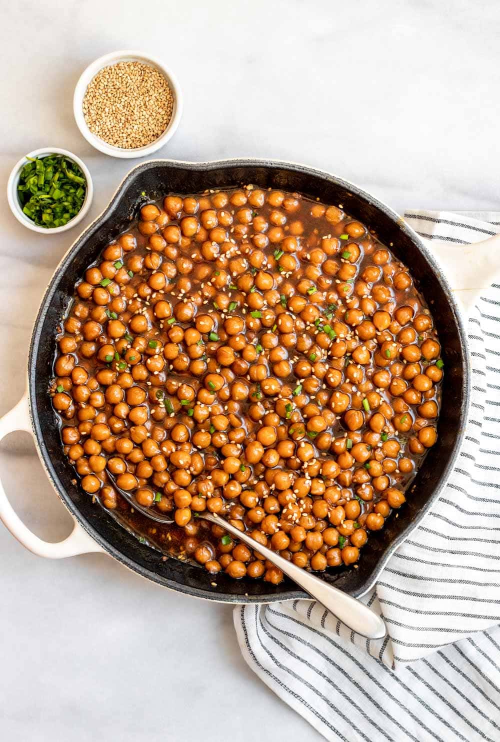 Easy chickpea recipe with chives and sesame seeds on top.