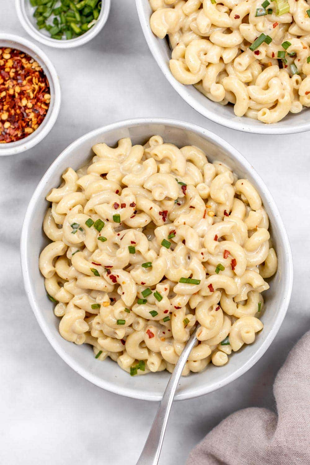 Roasted garlic dairy free mac and cheese in a bowl.