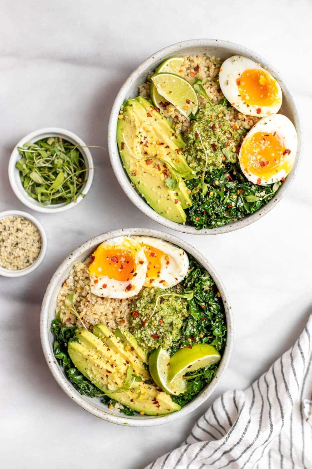 Quinoa breakfast bowl with kale, egg and avocado.