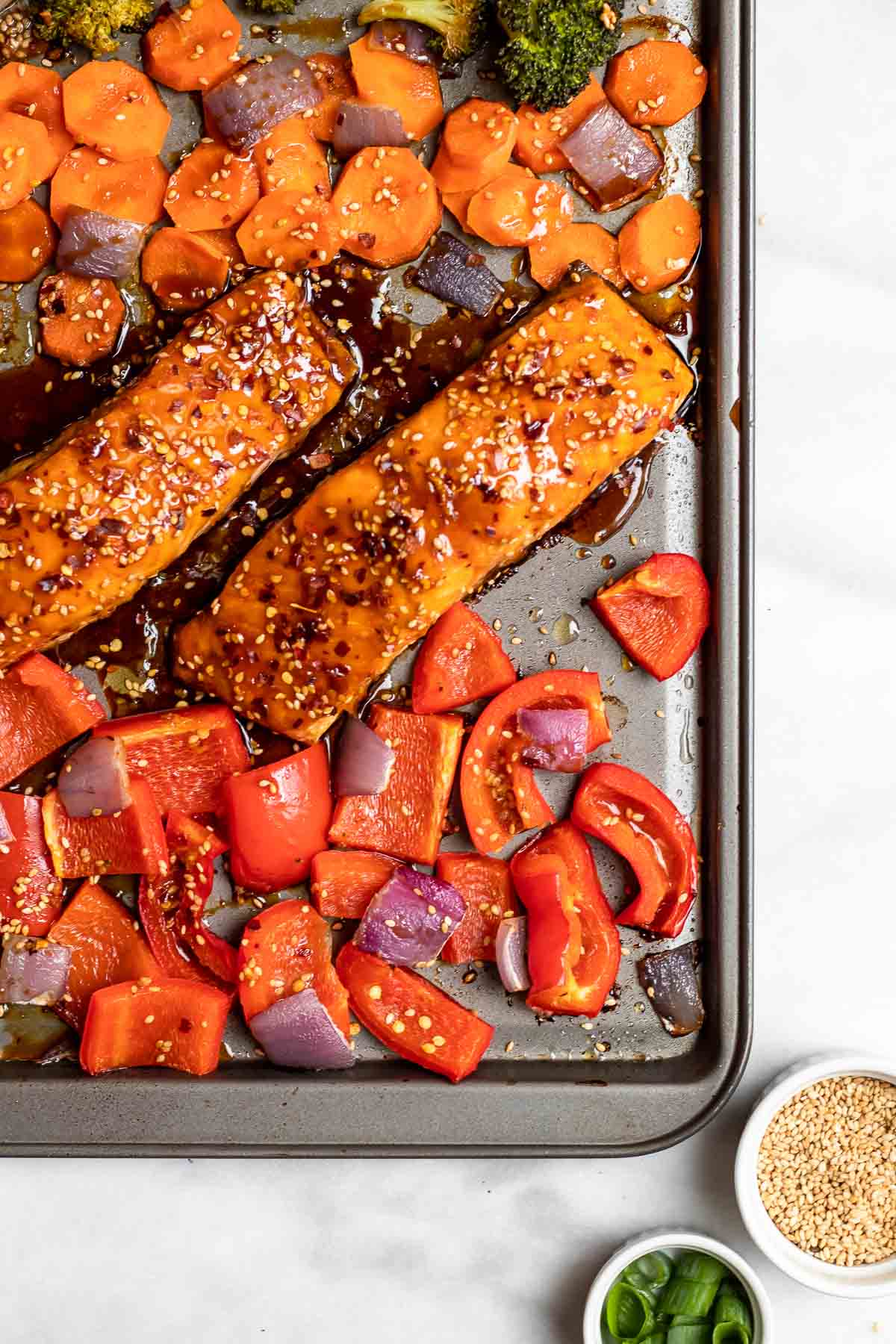 Up close of maple soy glazed salmon with vegetables.