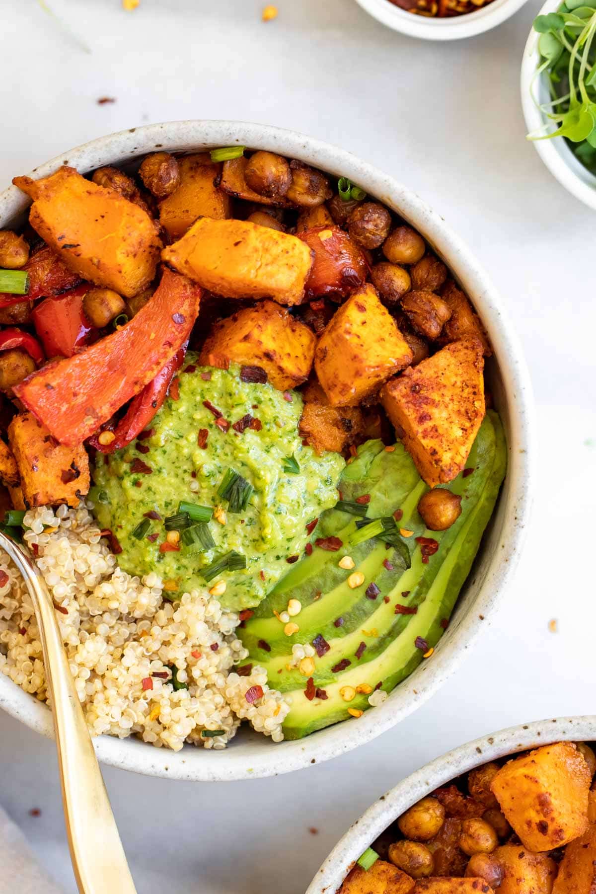 buddha bowl with chickpeas and a fork on the side