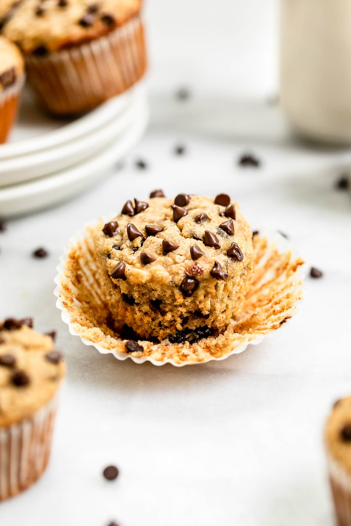almond flour banana muffin with chocolate chips on top with the wrapper off.