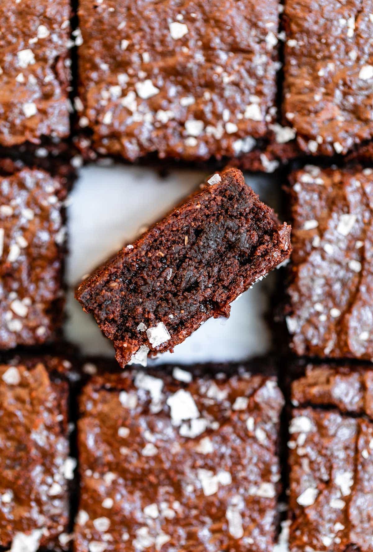 One brownie on the side to show texture.
