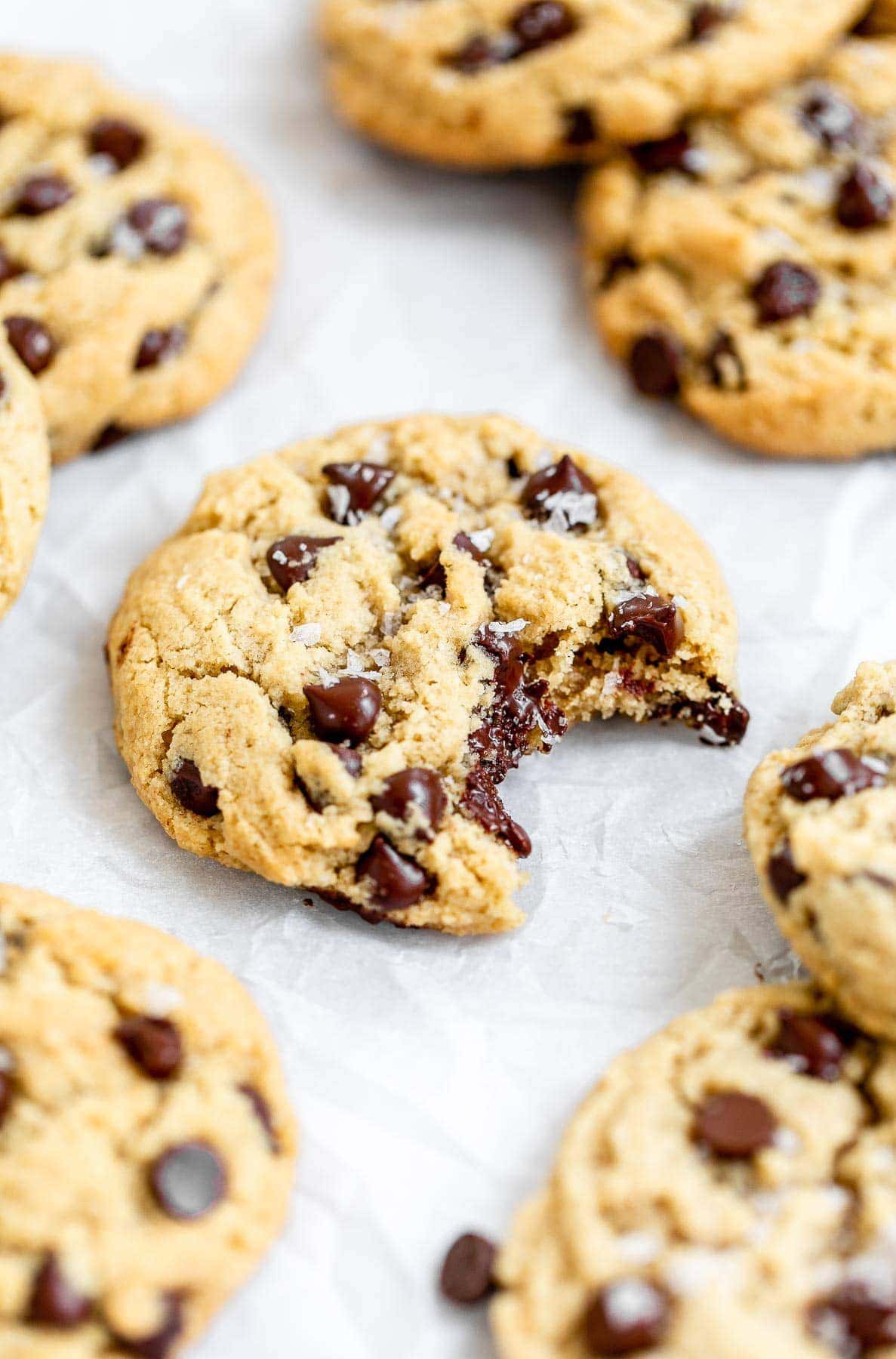 Almond flour cookies with chocolate chips on parchment paper.