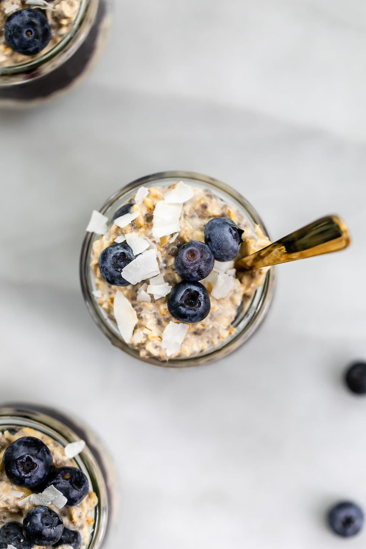 Overhead shot of blueberry overnight oats with a spoon on the side.