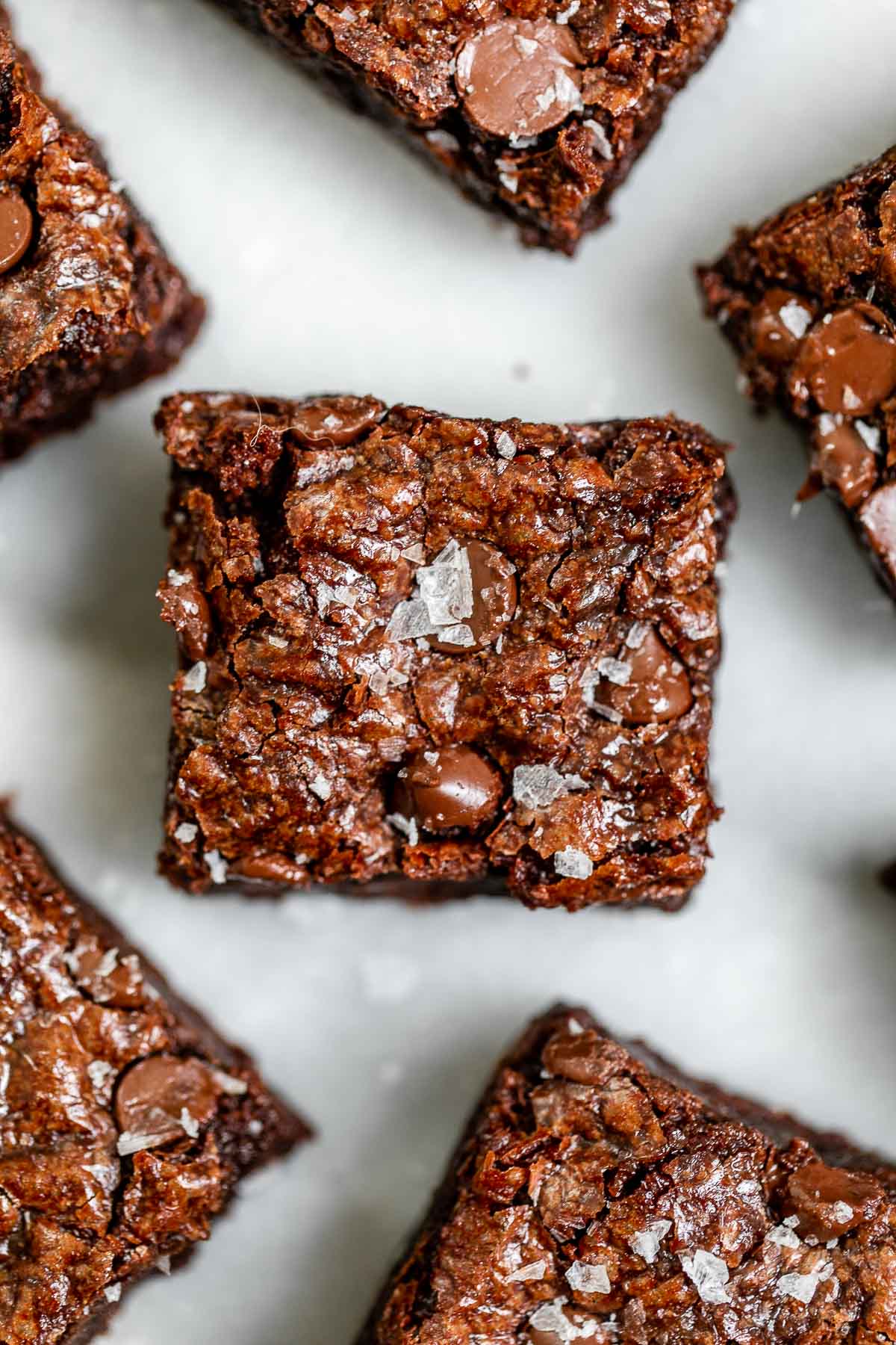 Up close overhead shot of the brownies cut into squares with sea salt.