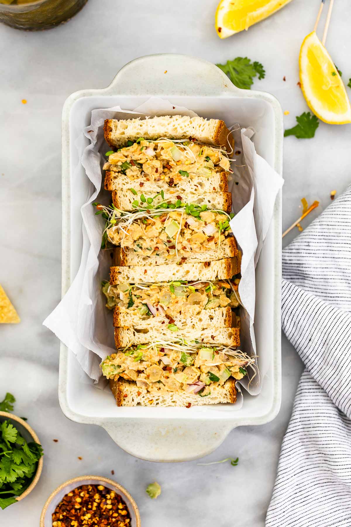 Vegan tuna chickpea salad sandwiches in a loaf pan.