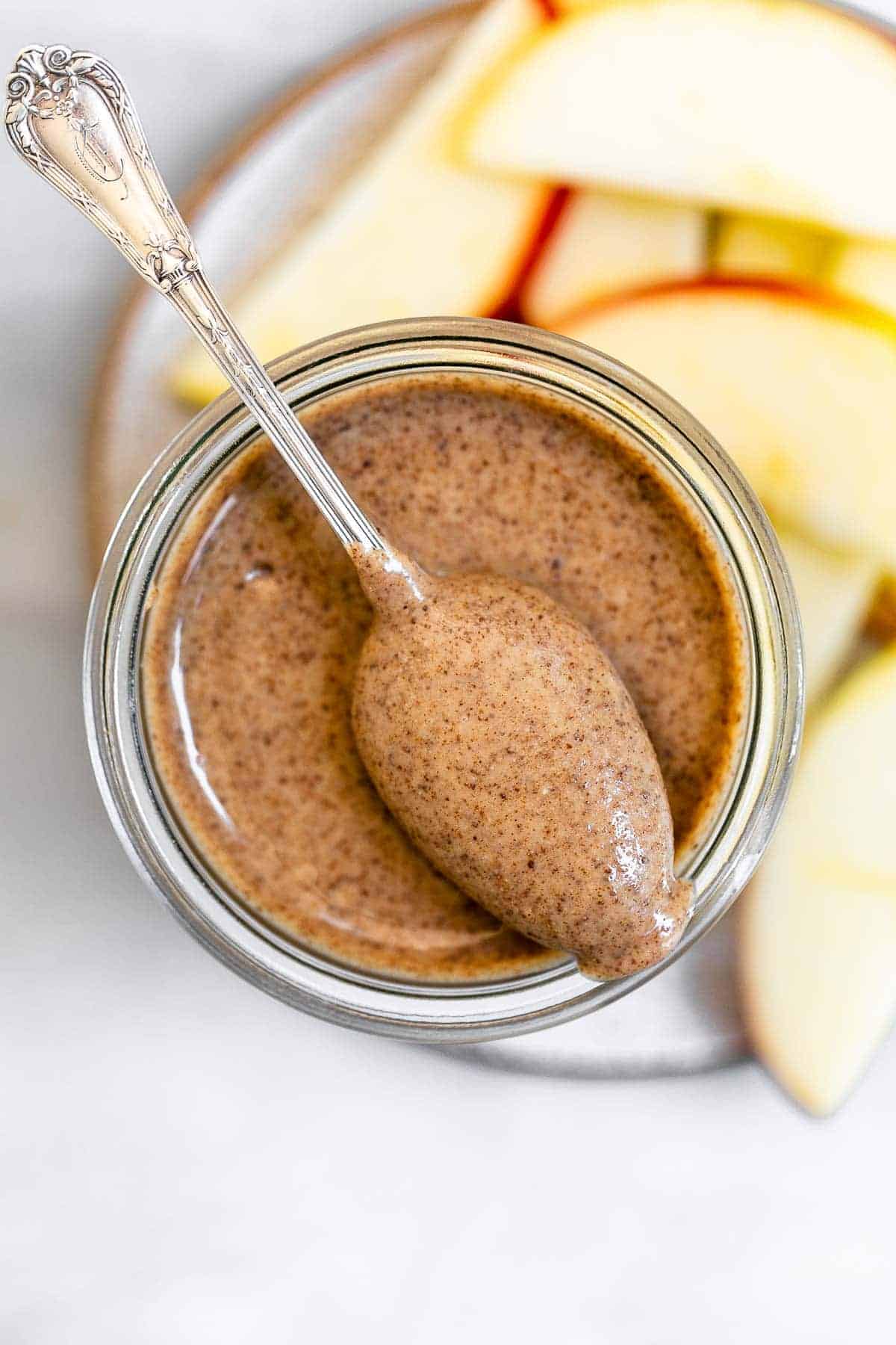 Almond butter with apple slices on the side.