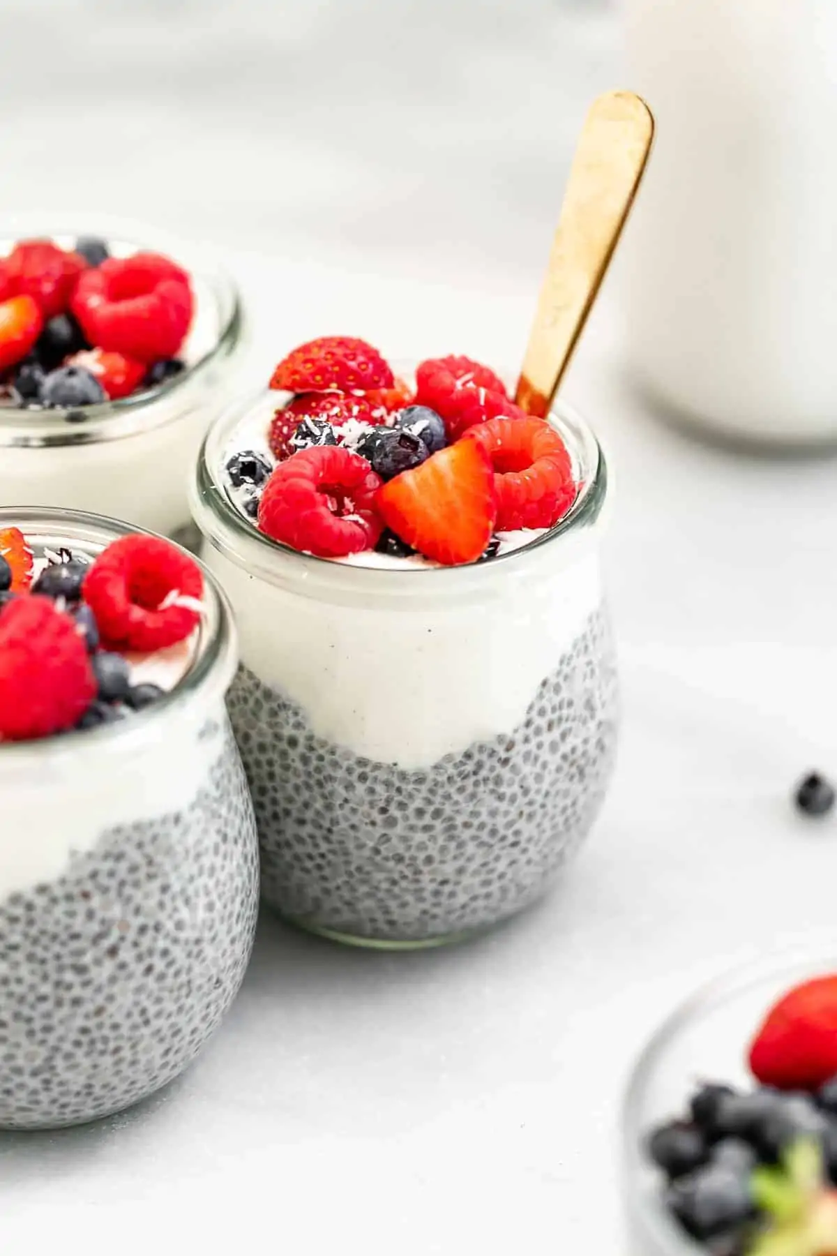 vegan chia seed pudding in jars with berries