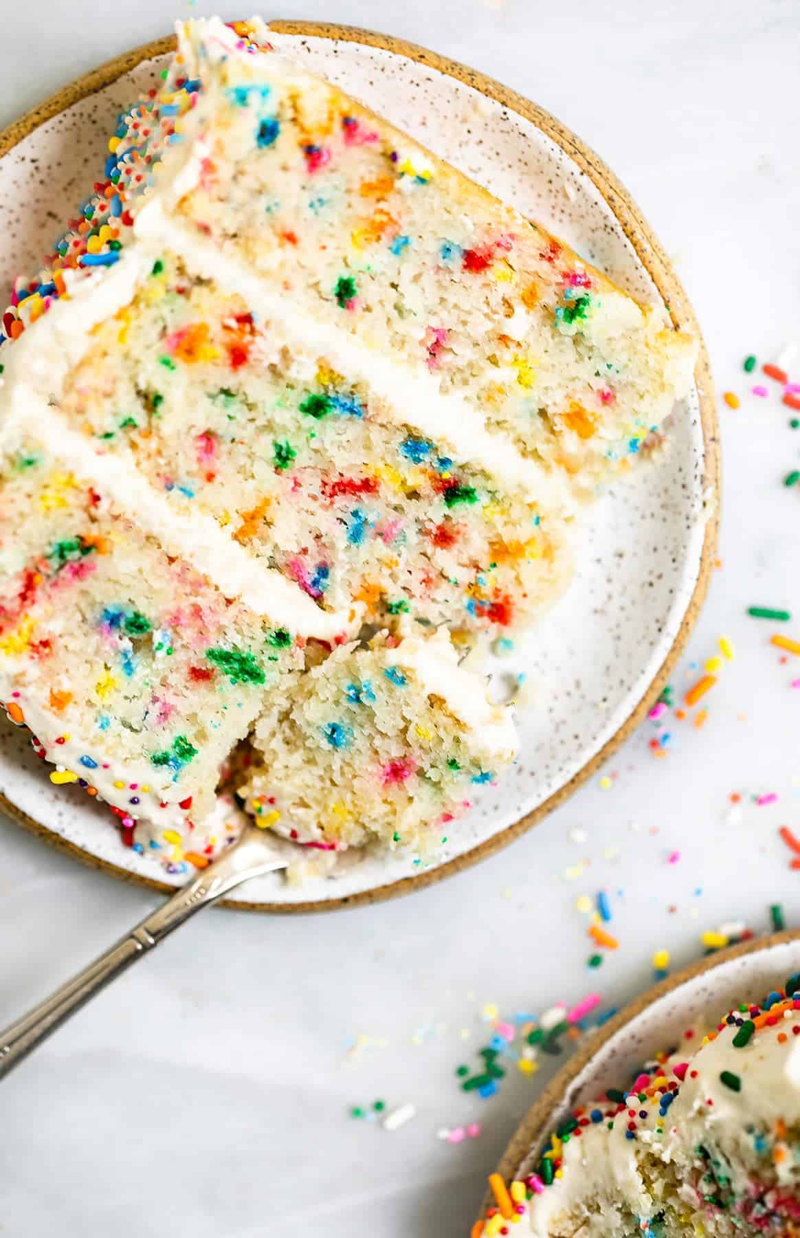 fork on a plate with a bite of the funfetti