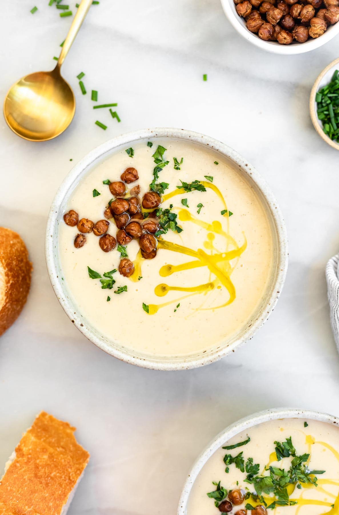 Vegan cauliflower soup with roasted chickpeas on top.
