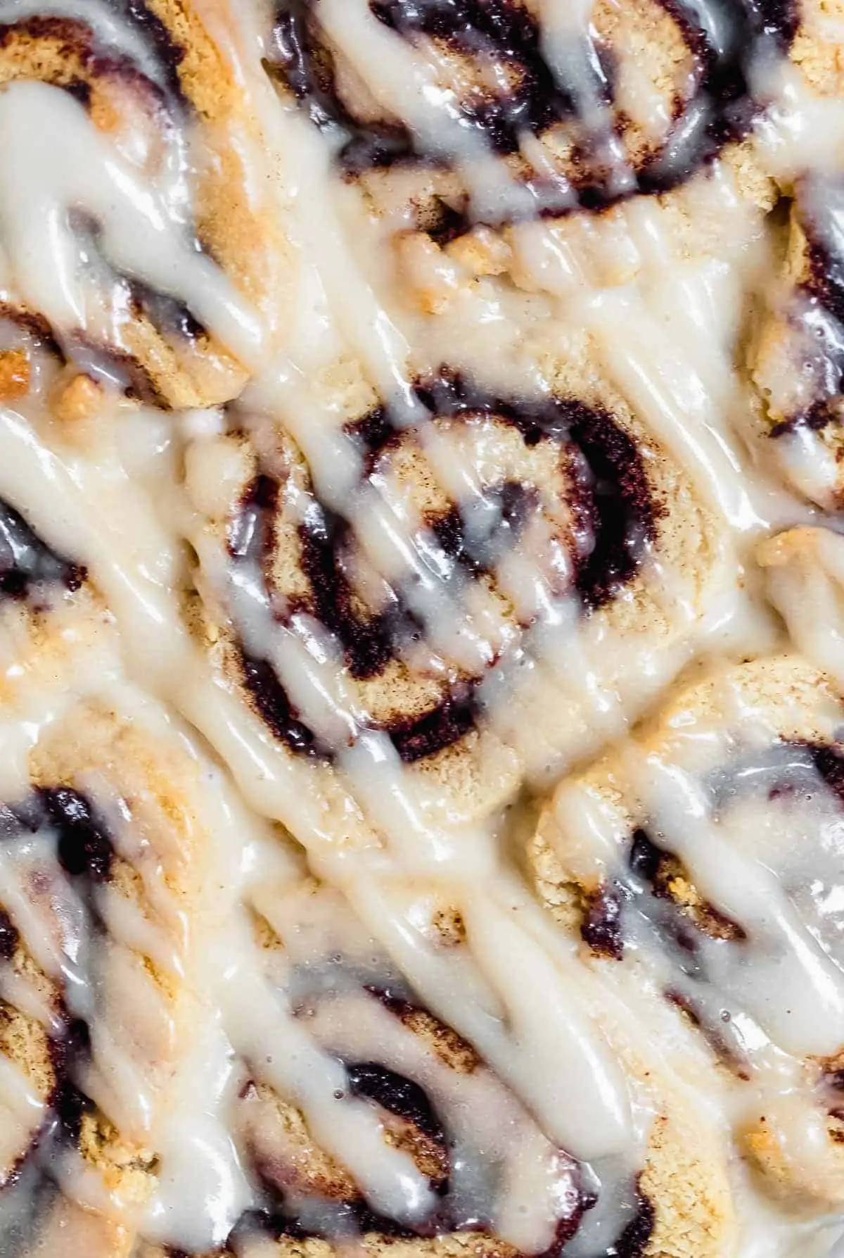 Up close image of cinnamon rolls to show gooey texture.
