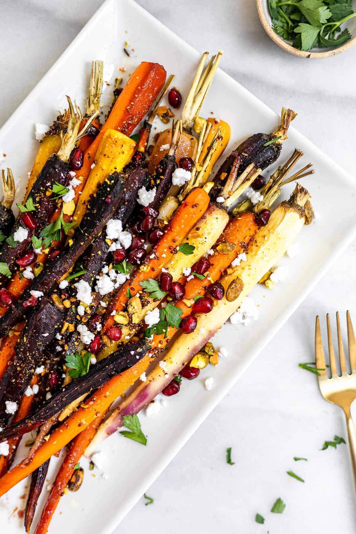 Final rainbow roasted maple glazed carrots with pistachios and feta.