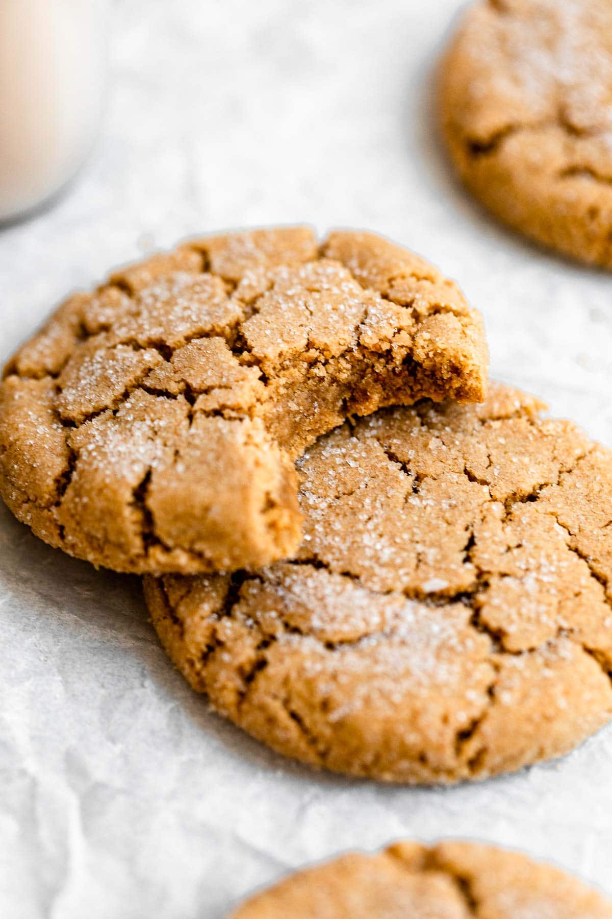 two vegan peanut butter cookies with a bite taken out