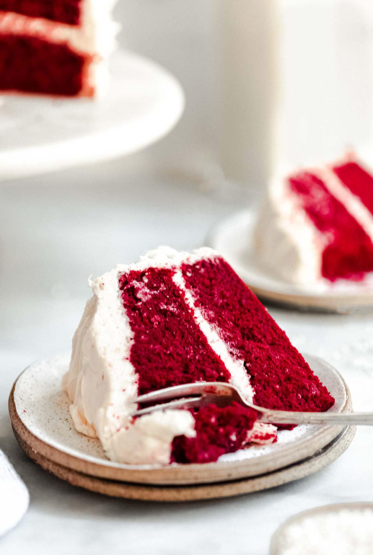 red velvet cake on a plate with a fork