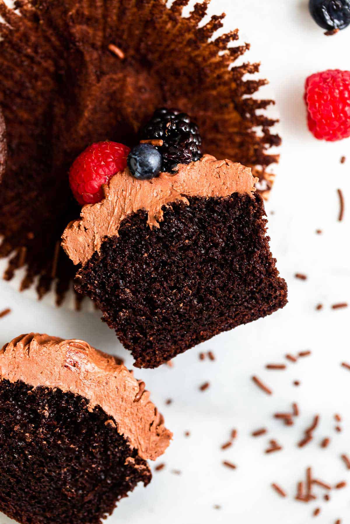one chocolate cupcake cut in half to show texture
