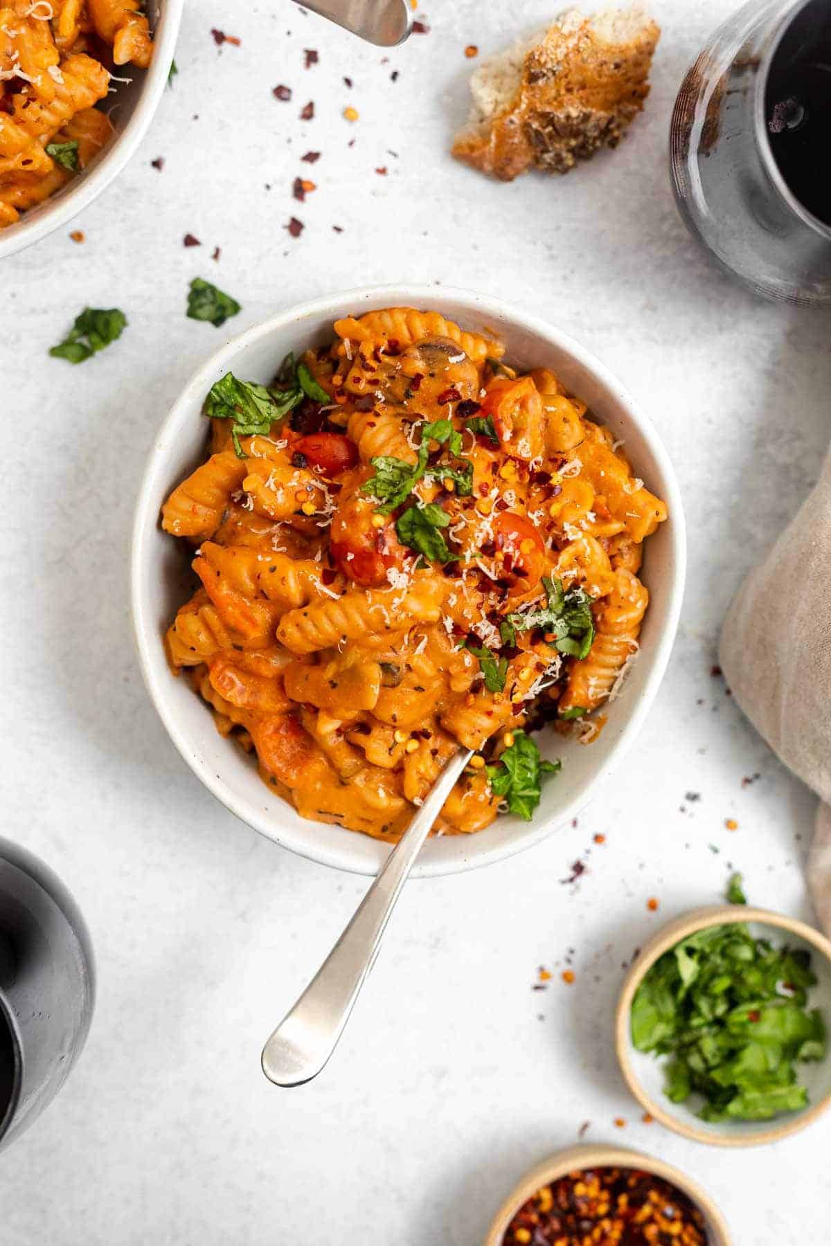 vegan one pot pasta in a small bowl with basil on top