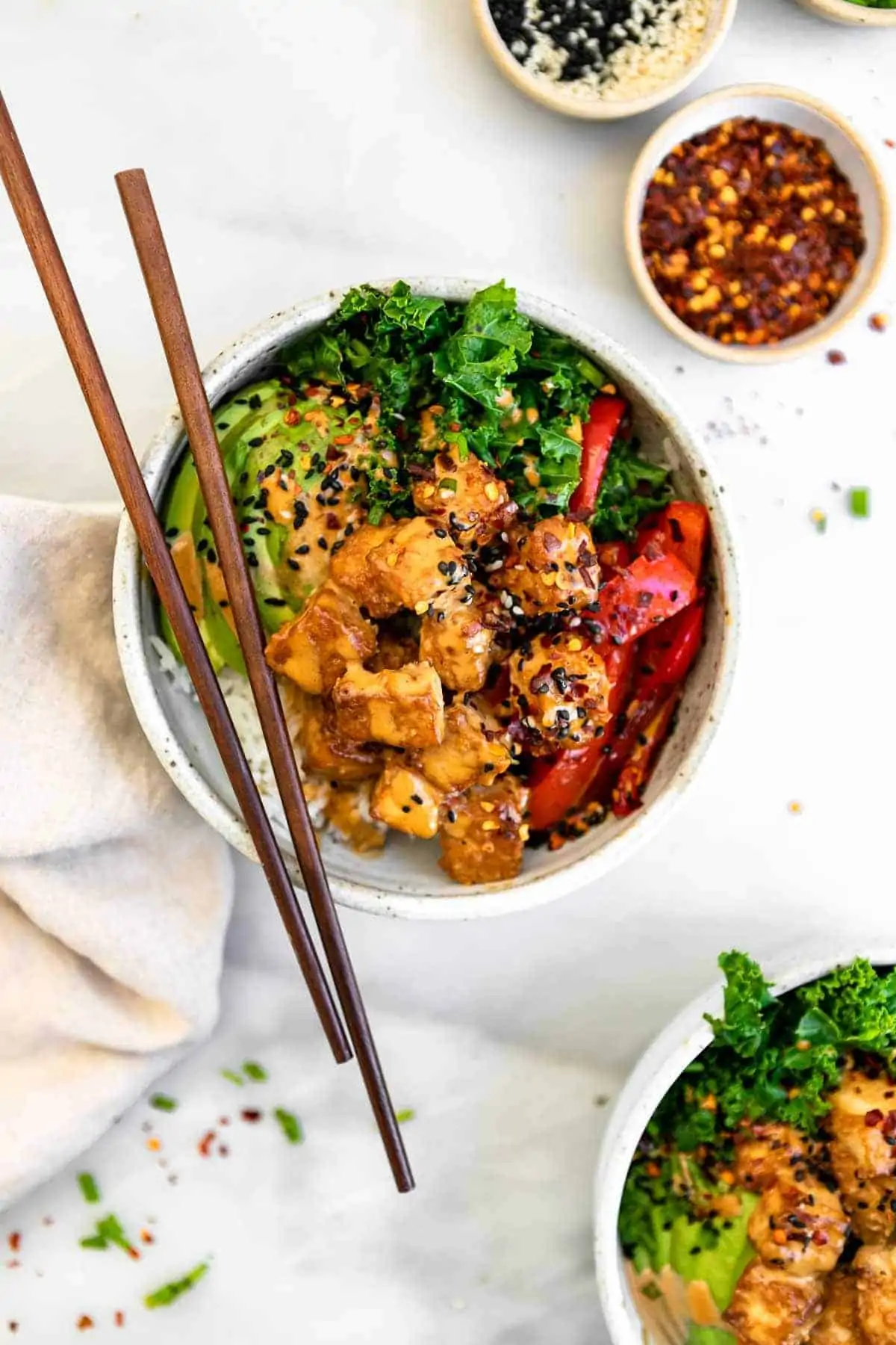 peanut tofu bowls with peanut butter sauce on top
