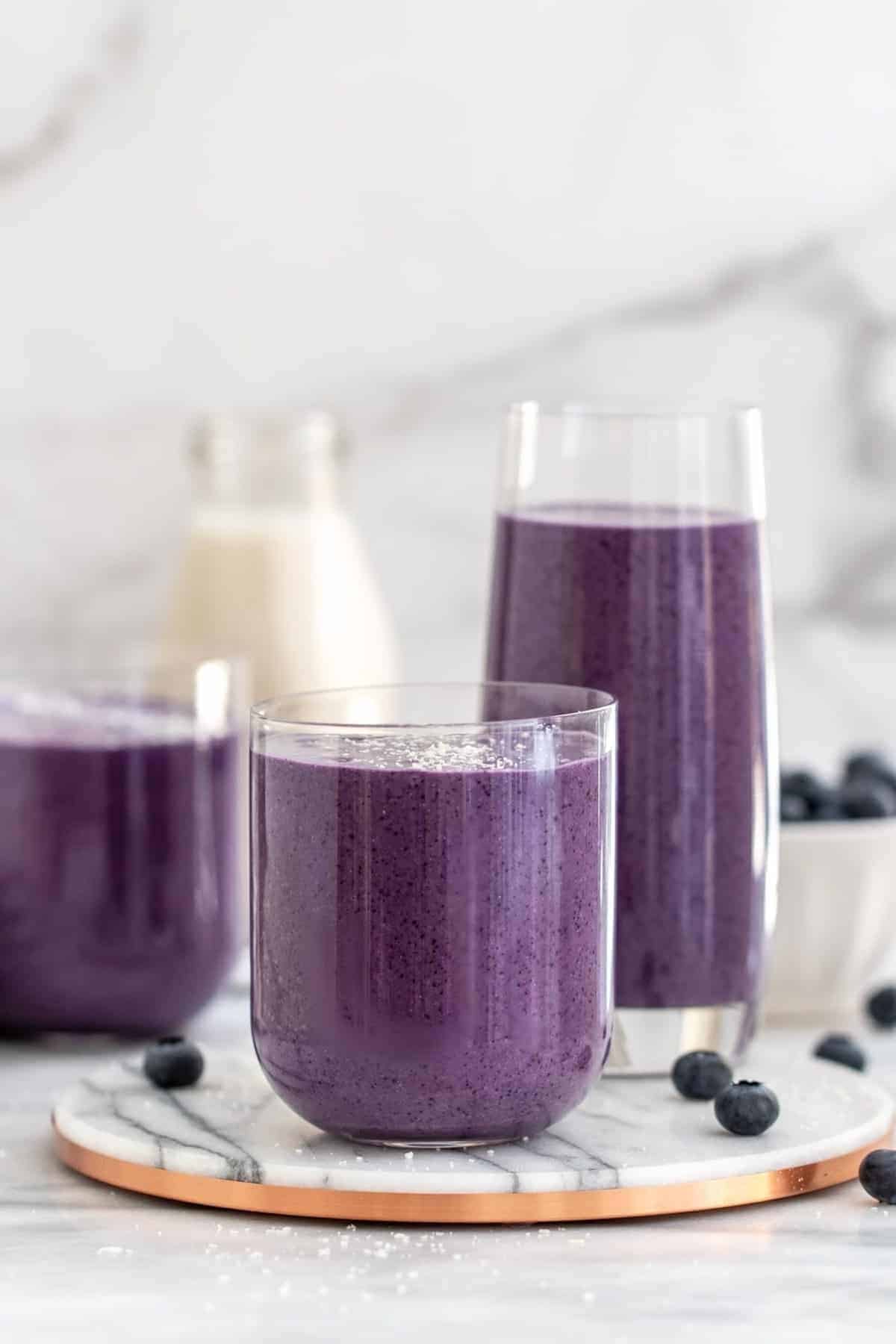 blueberry avocado smoothie in three glasses