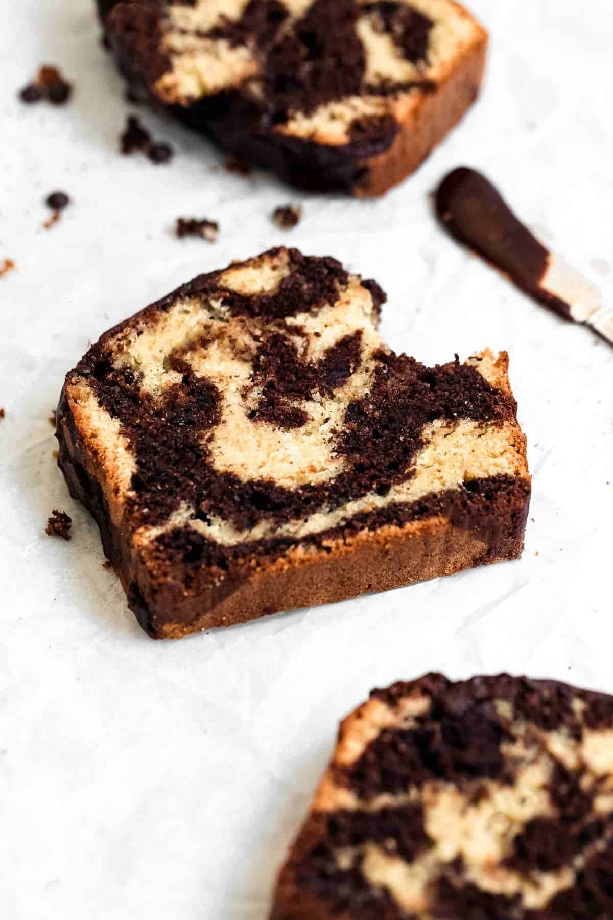 three slices of the gluten free marble cake with a bite taken out