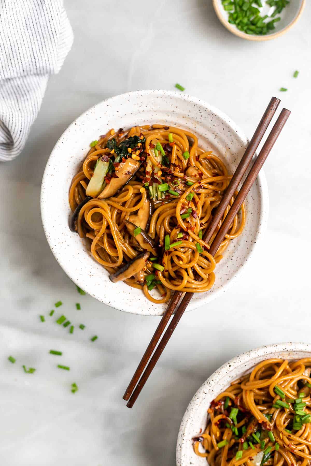 teriyaki noodles in a bowl with chopsticks