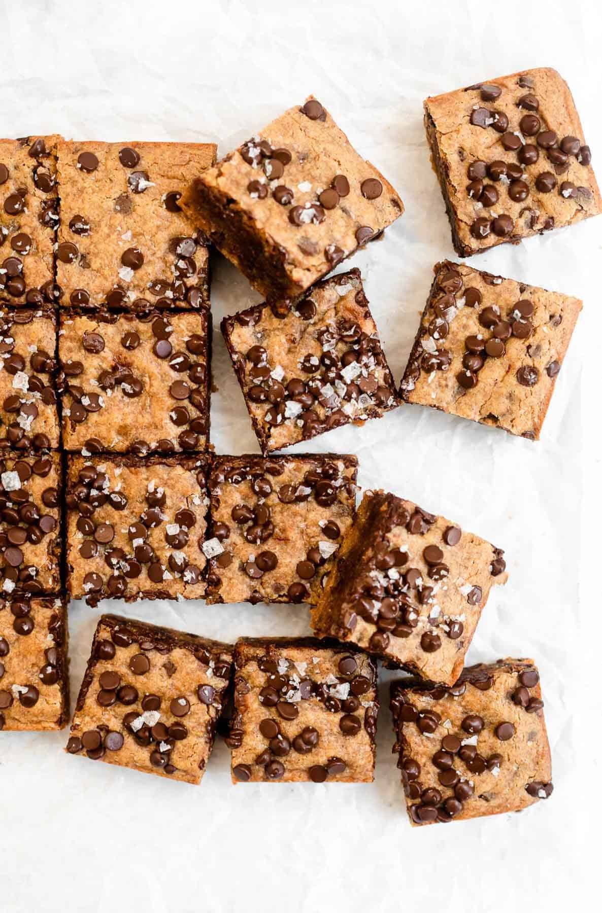 vegan blondies with chocolate chips on top cut into squares 