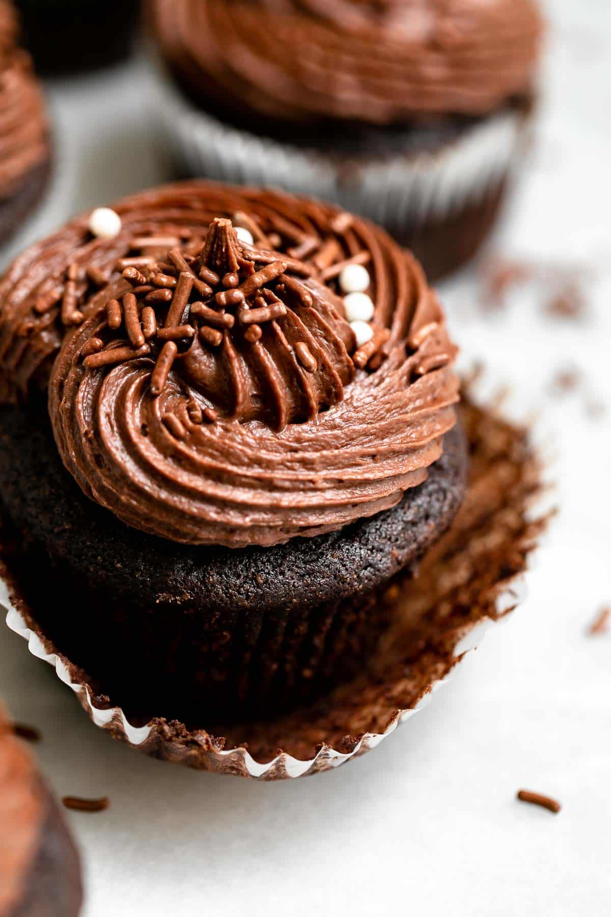 vegan chocolate cupcakes with buttercream on top