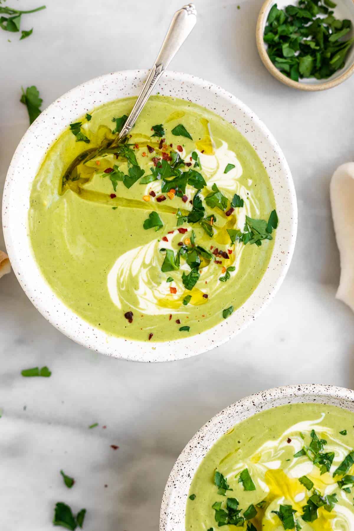vegan cream of broccoli soup in a white bowl