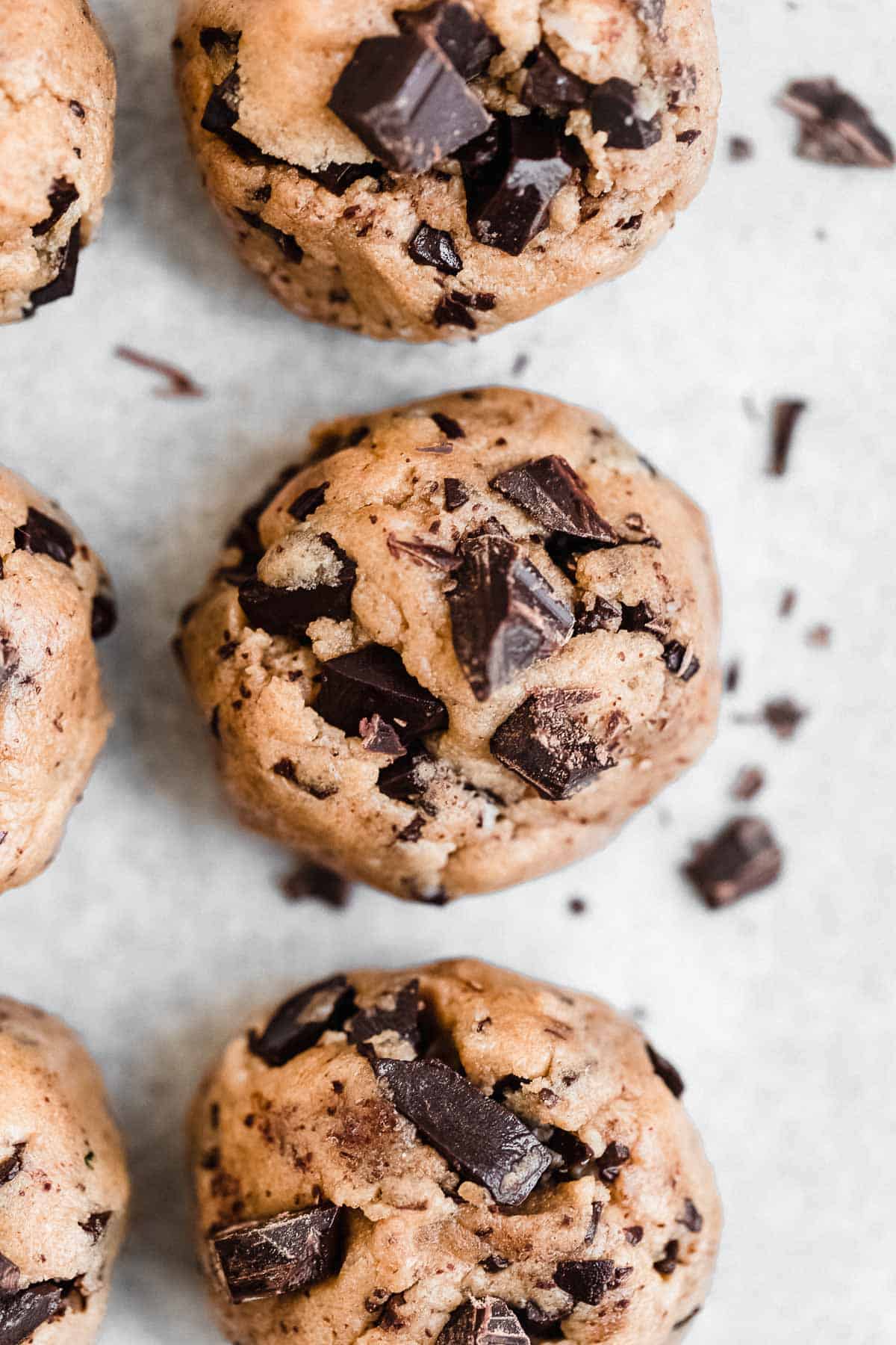cookie dough rolled into balls with chocolate chunks