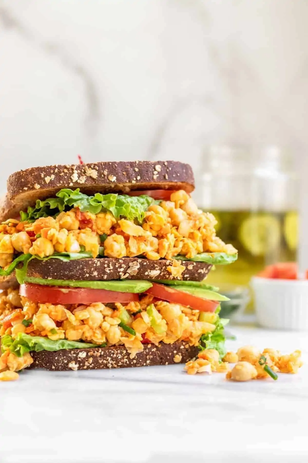 Double decker sandwich with chickpea salad, lettuce and tomato. 