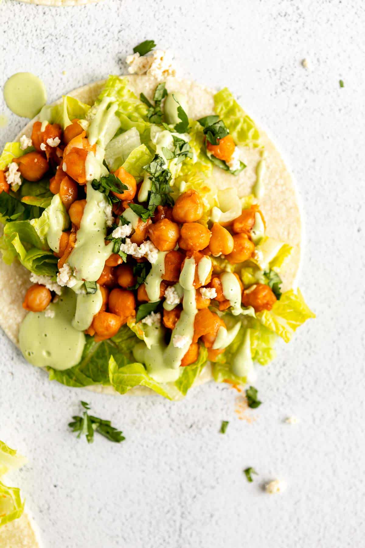 up close image of the vegan chickpea tacos with cilantro