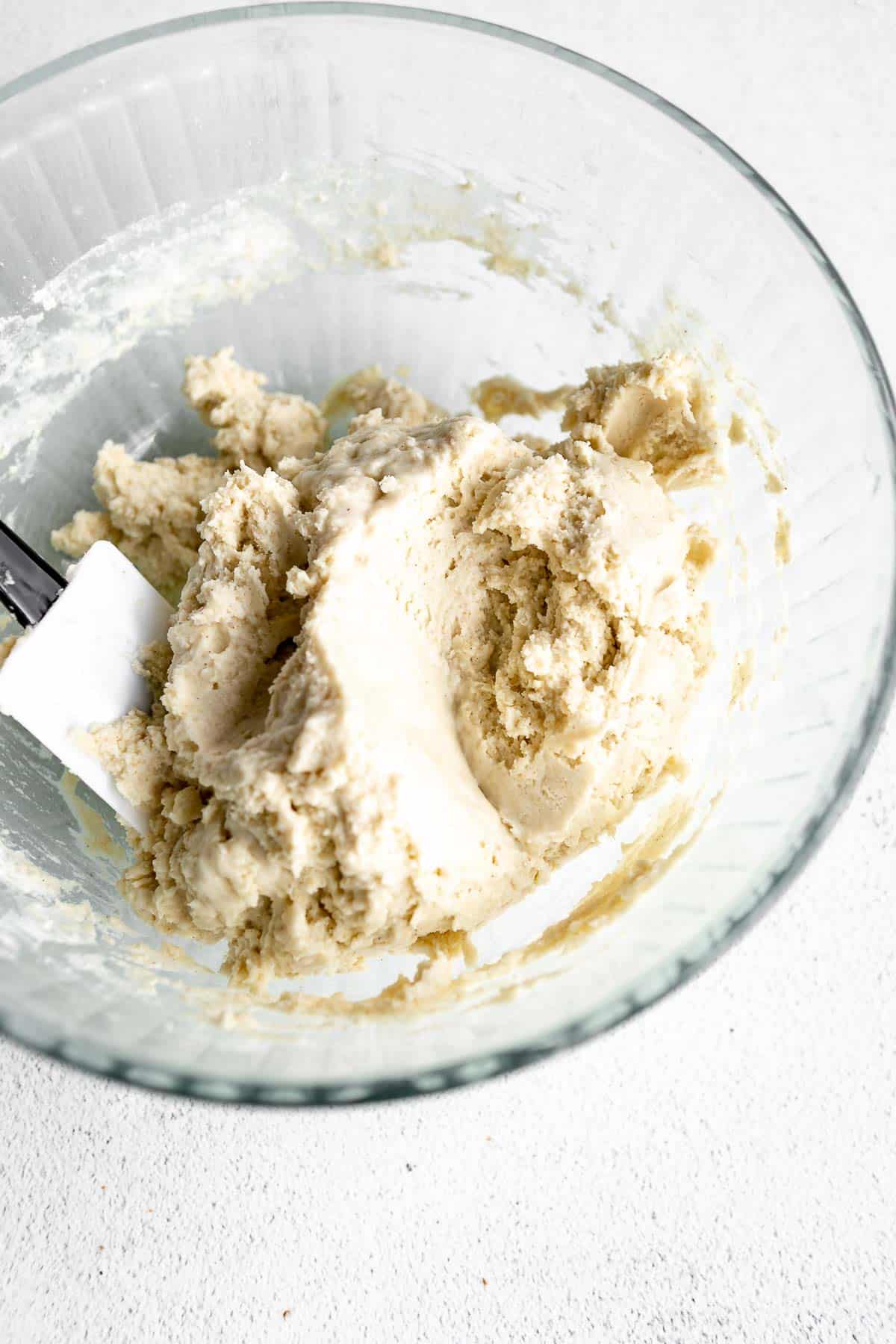 dough in a glass mixing bowl 