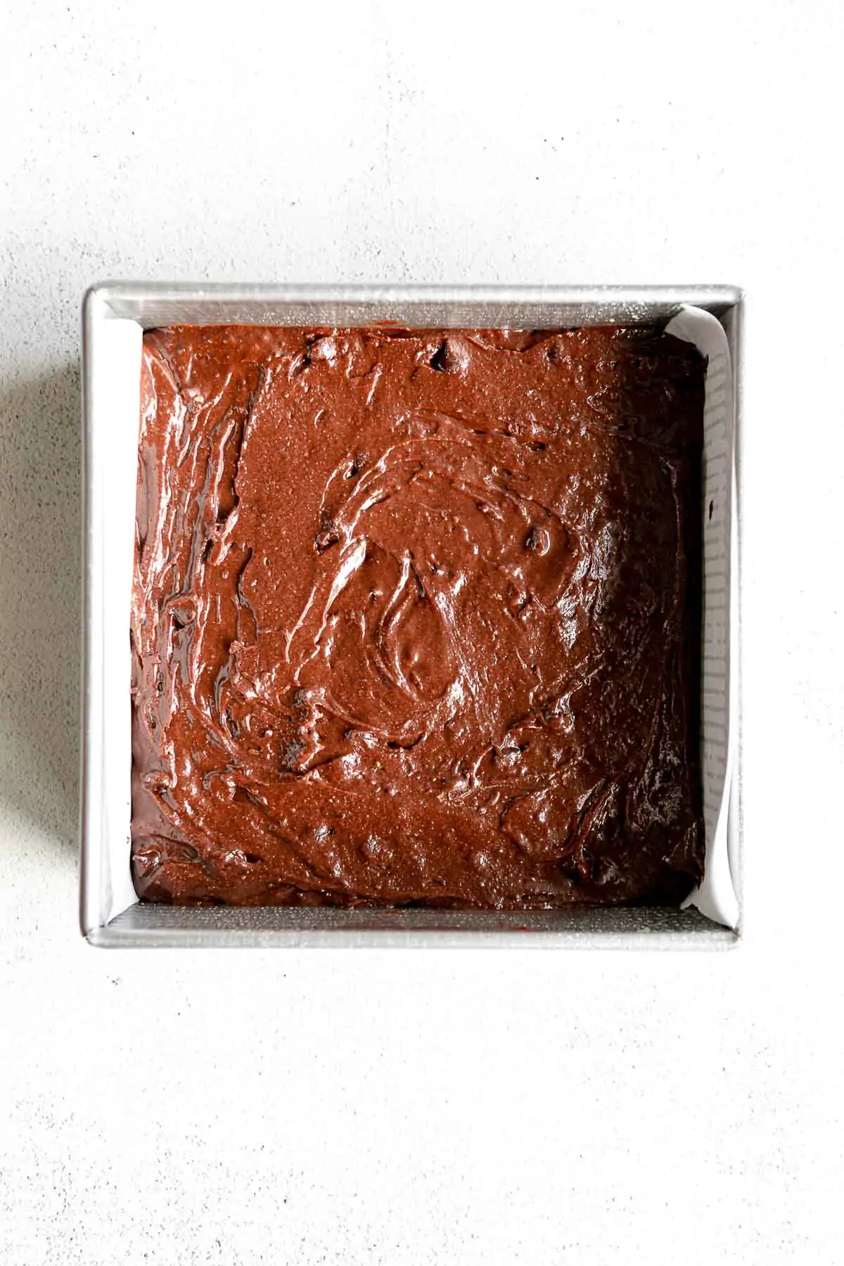 brownie batter in a pan before baking