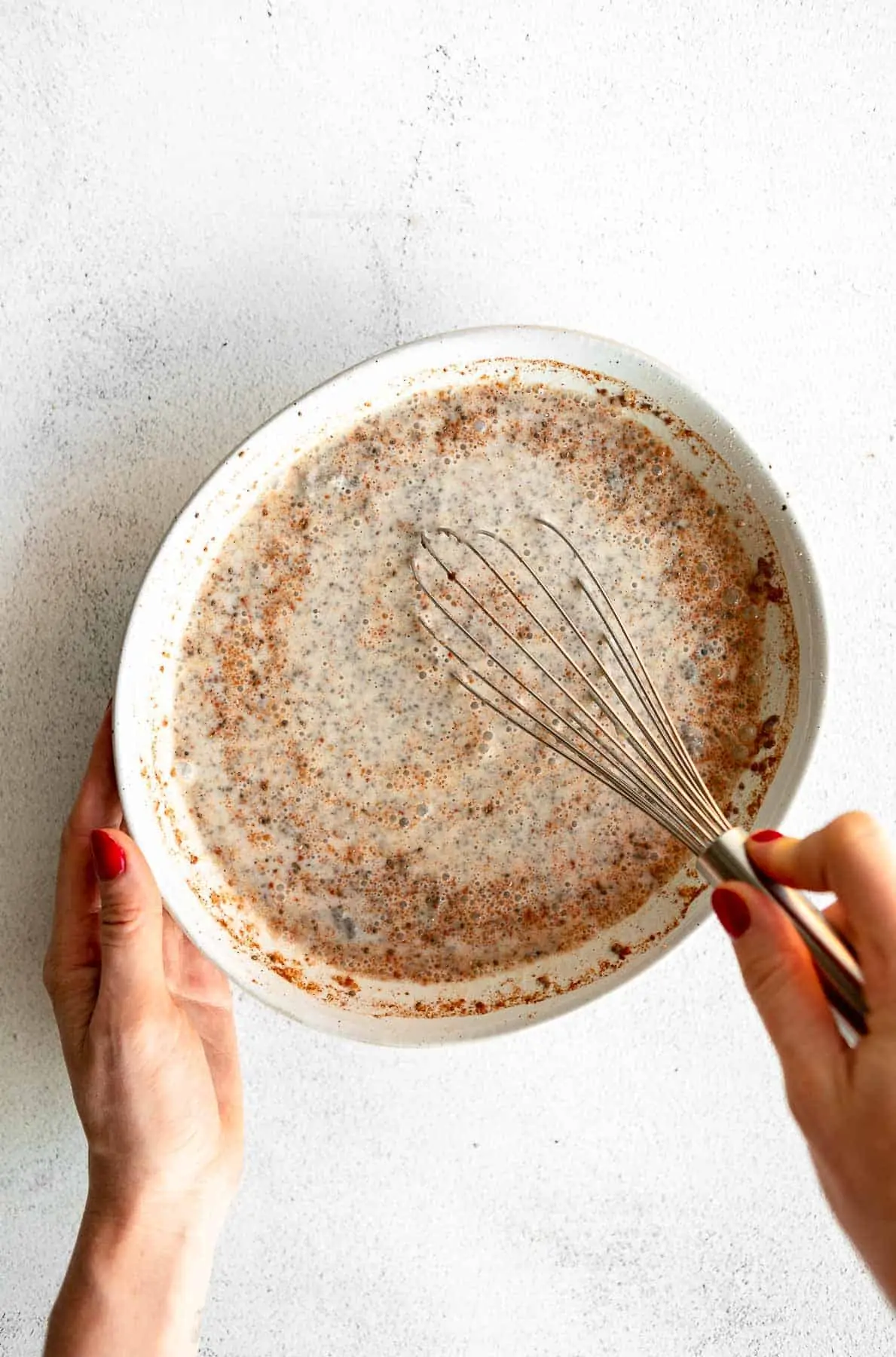 whisking up the chia pudding in a bowl
