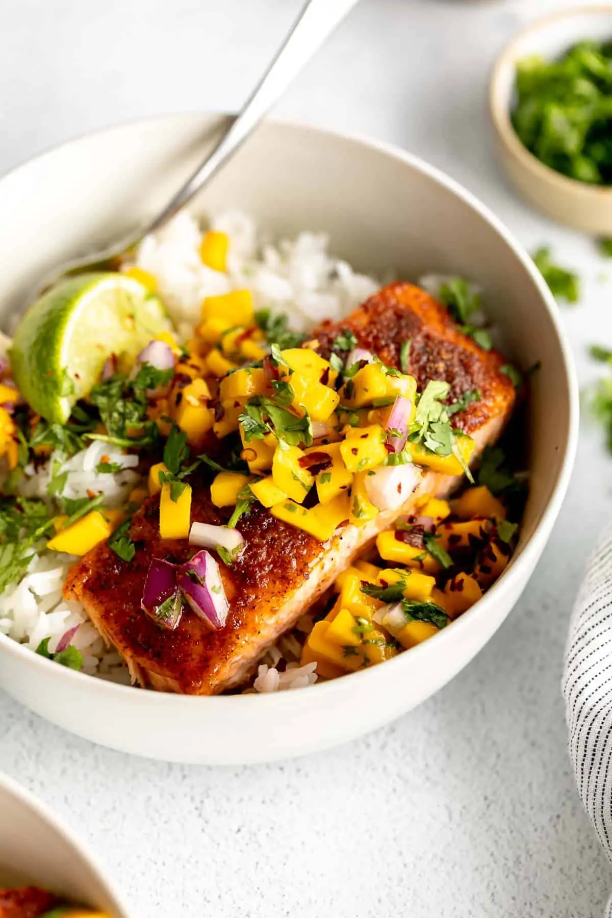 baked cajun salmon with mango salsa in a bowl