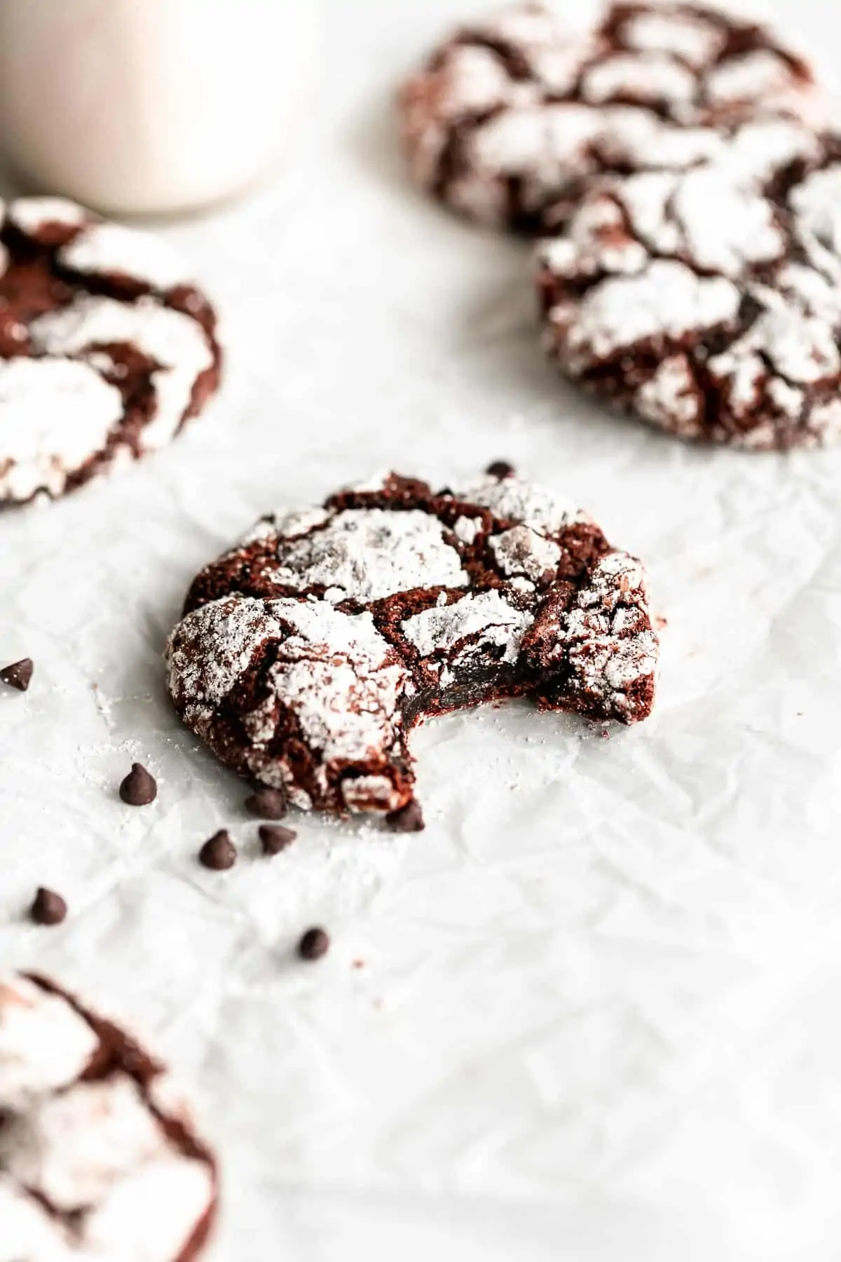 gluten free chocolate crinkle cookies with a bite taken out