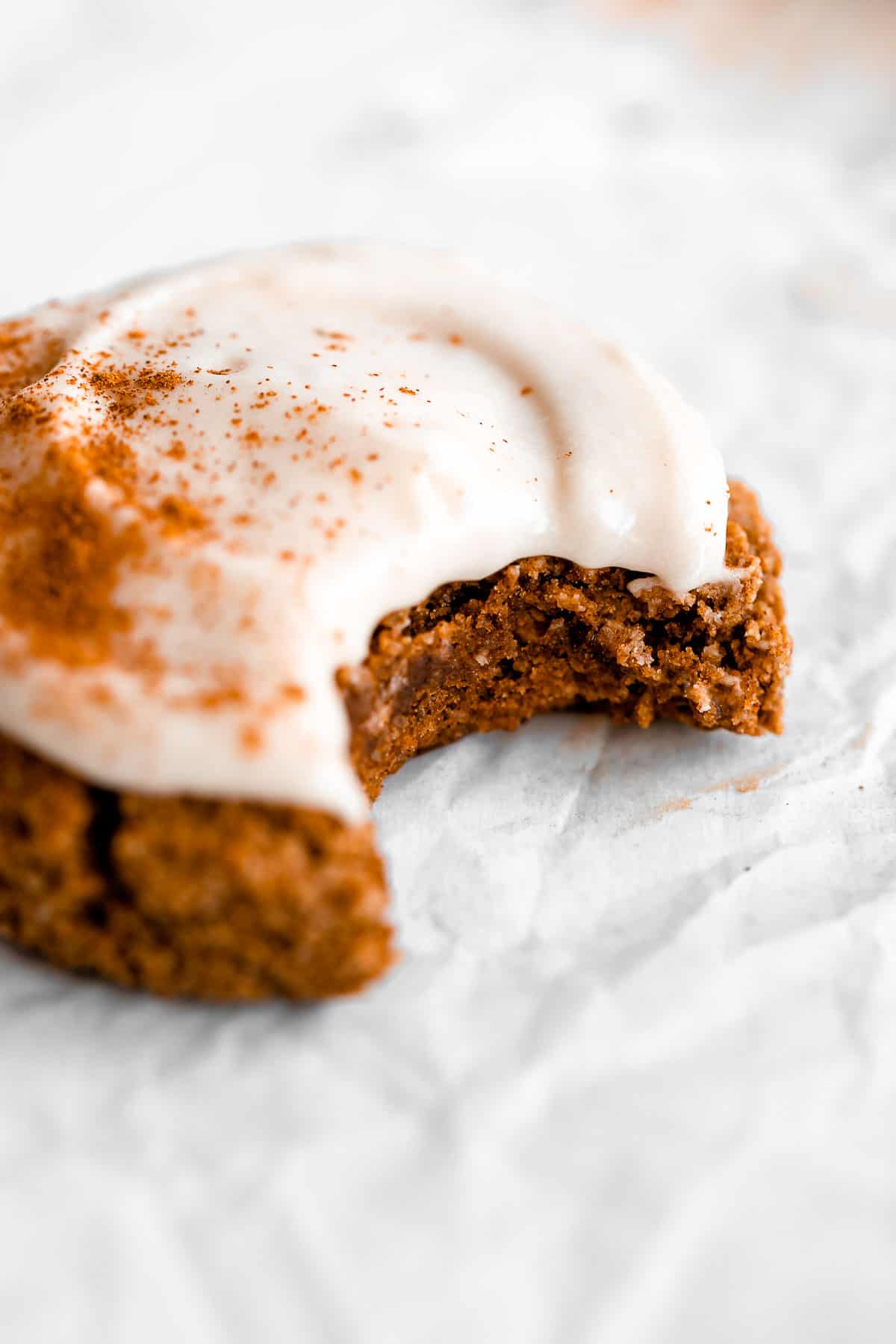 vegan pumpkin cookie with a bite taken out