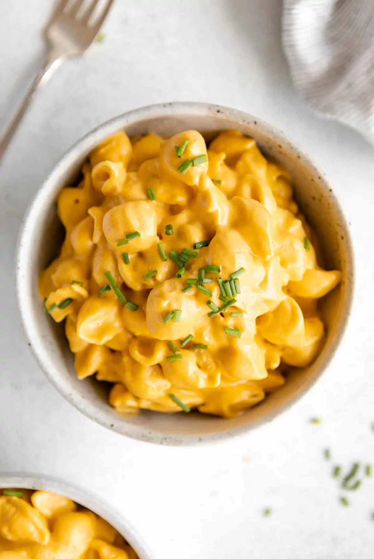 vegan butternut squash mac and cheese with chives on top