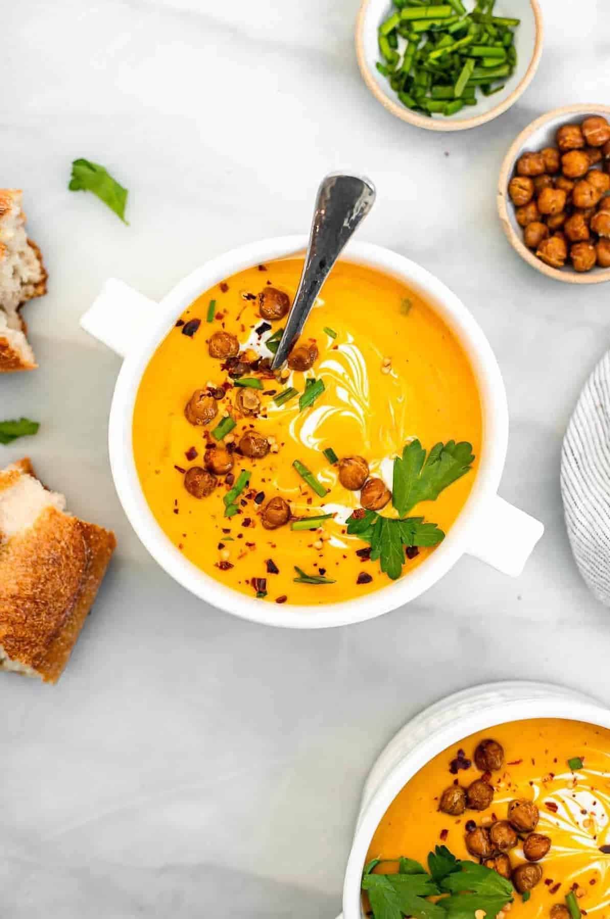 Overhead image of vegan butternut squash soup with roasted chickpeas. 