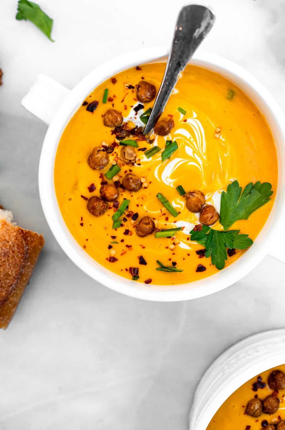 Vegan butternut squash soup with crispy chickpeas on top.