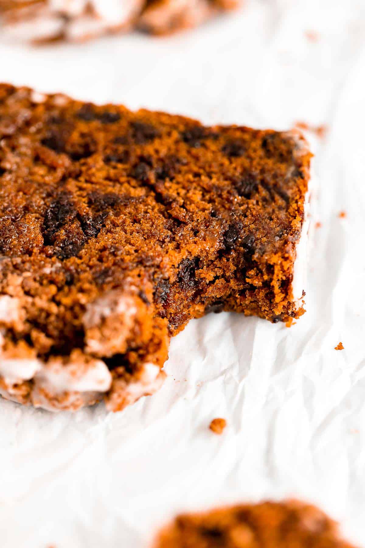 up close image of the pumpkin bread with a bite taken out to show texture