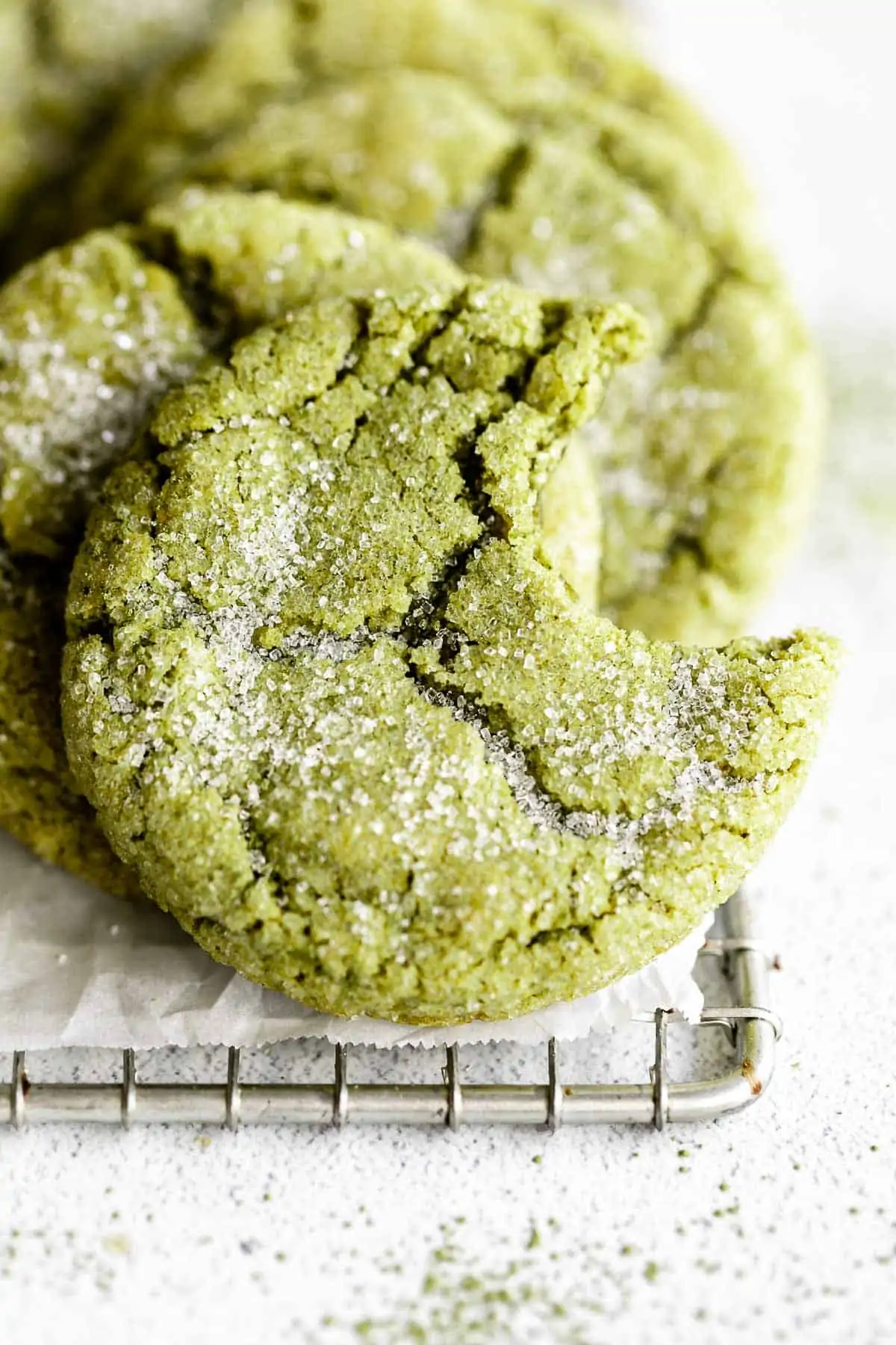 matcha sugar cookies with a bite taken out 