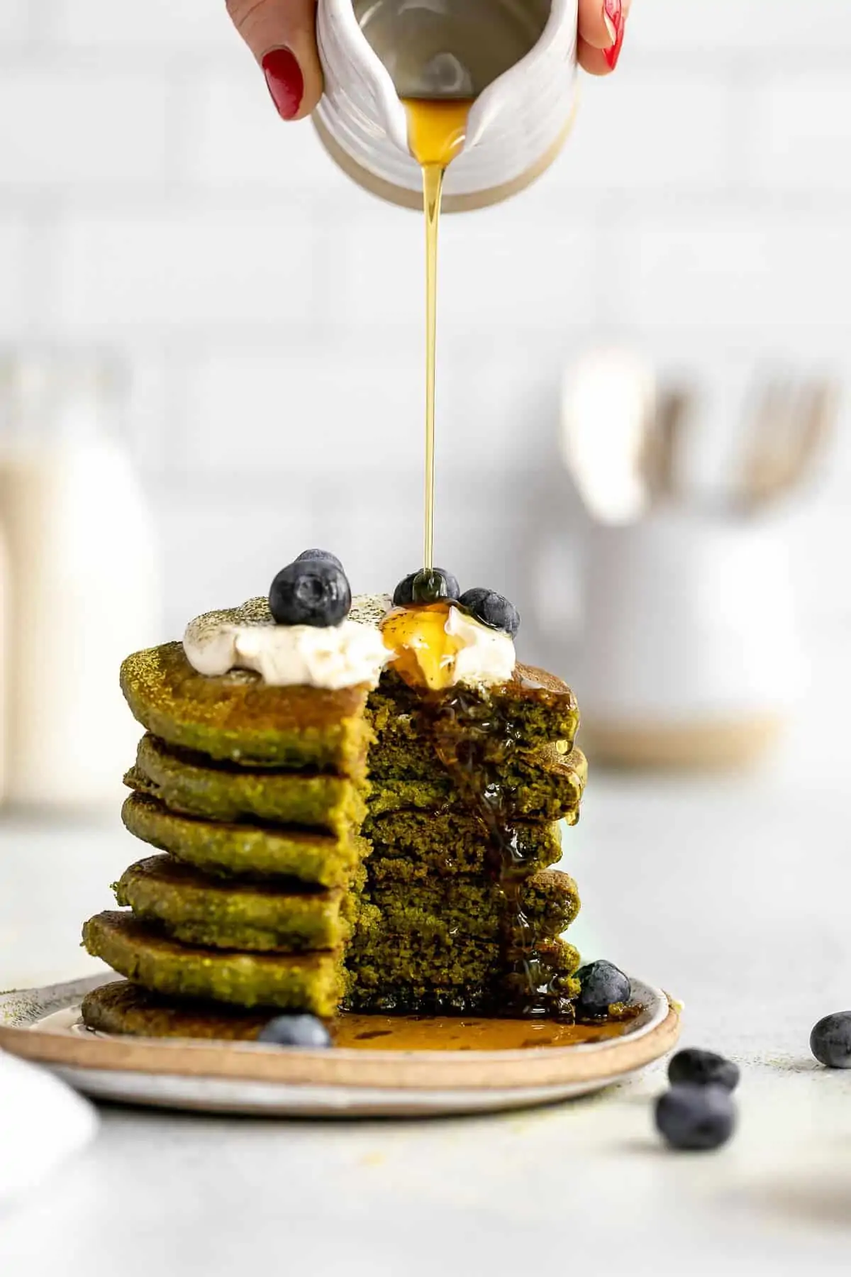 stack of match pancakes with a bite cut out to show texture